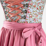 Traditional German dirndl dress with floral top and pink skirt 