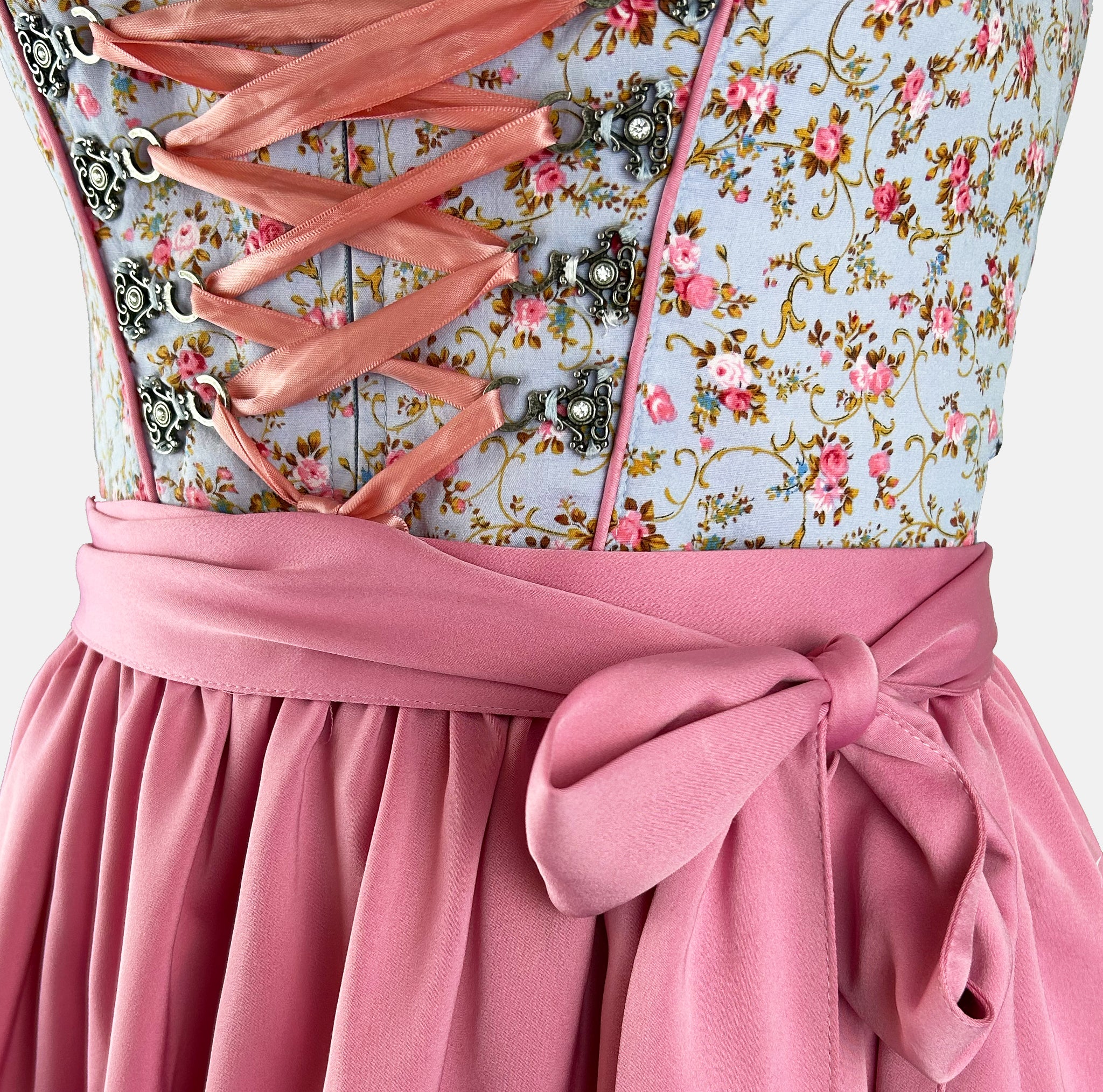Traditional German dirndl dress with floral top and pink skirt 