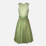 Alpenherz Dirndl Sunny in vibrant apple green with flattering cut and matching apron – fresh, modern, and ideal for festive occasions.