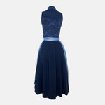 Apple of my Eye blends timeless tradition with contemporary design. The deep blue jacquard bodice features an elegant floral pattern