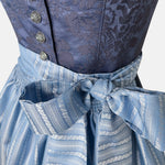 Apple of my Eye blends timeless tradition with contemporary design. The deep blue jacquard bodice features an elegant floral pattern