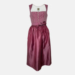 Burgundy Krüger dirndl with floral lace embroidery, satin ribbon bow, and decorative bodice – available for rent at Versatile OTM.