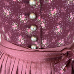 Rent the elegant Berwin & Wolff dirndl dress—wine-red floral pattern, dotted skirt, slim floral belt; rental dirndl