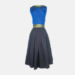 Berwin & Wolff Dirndl with royal blue embroidered bodice and shiny olive-green apron, available to rent at Versatile OTM.