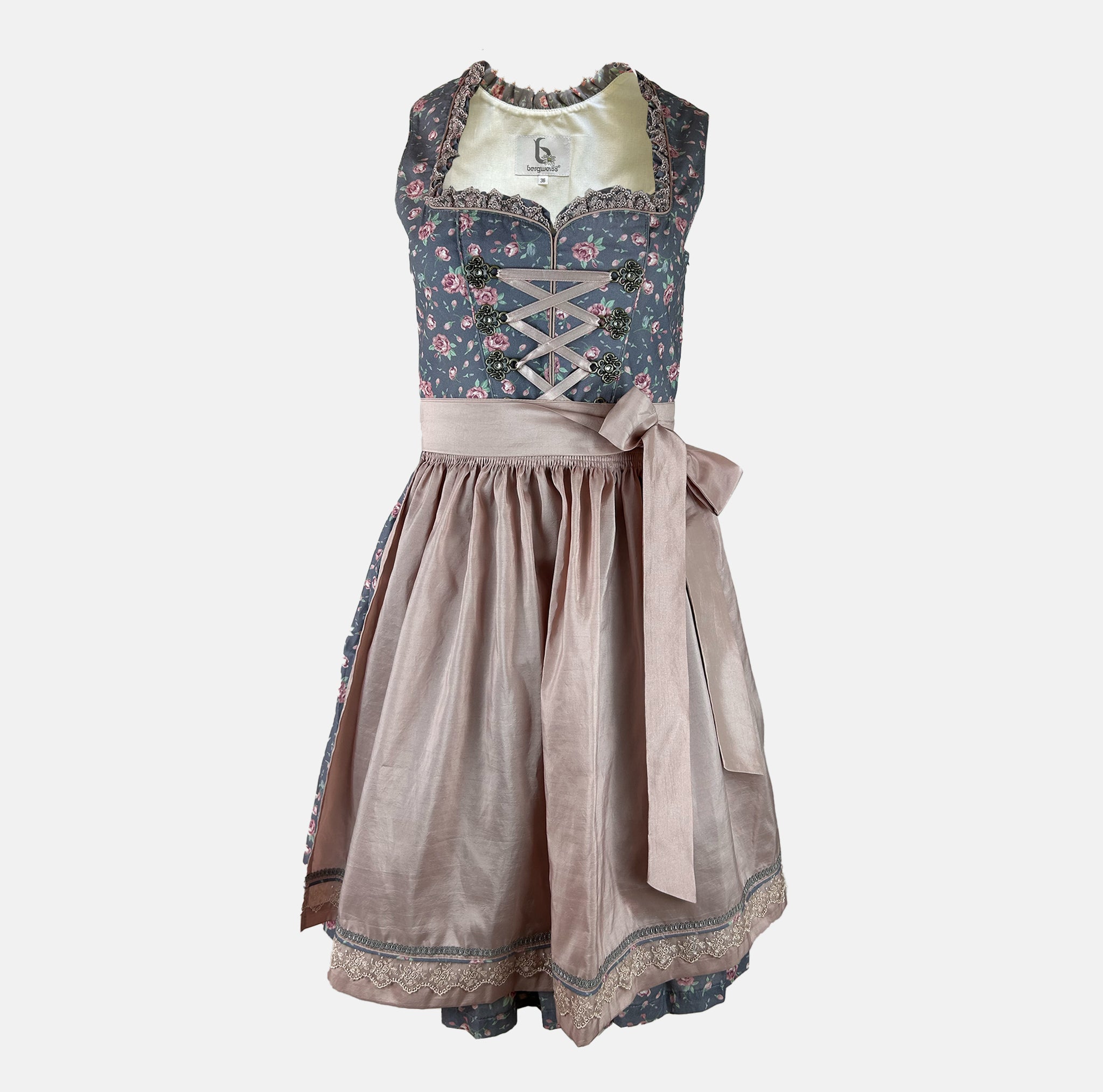 Blue floral dirndl with shimmering rosé apron and vintage-style details – perfect for fashionable Oktoberfest moments or elegant Bavarian events.