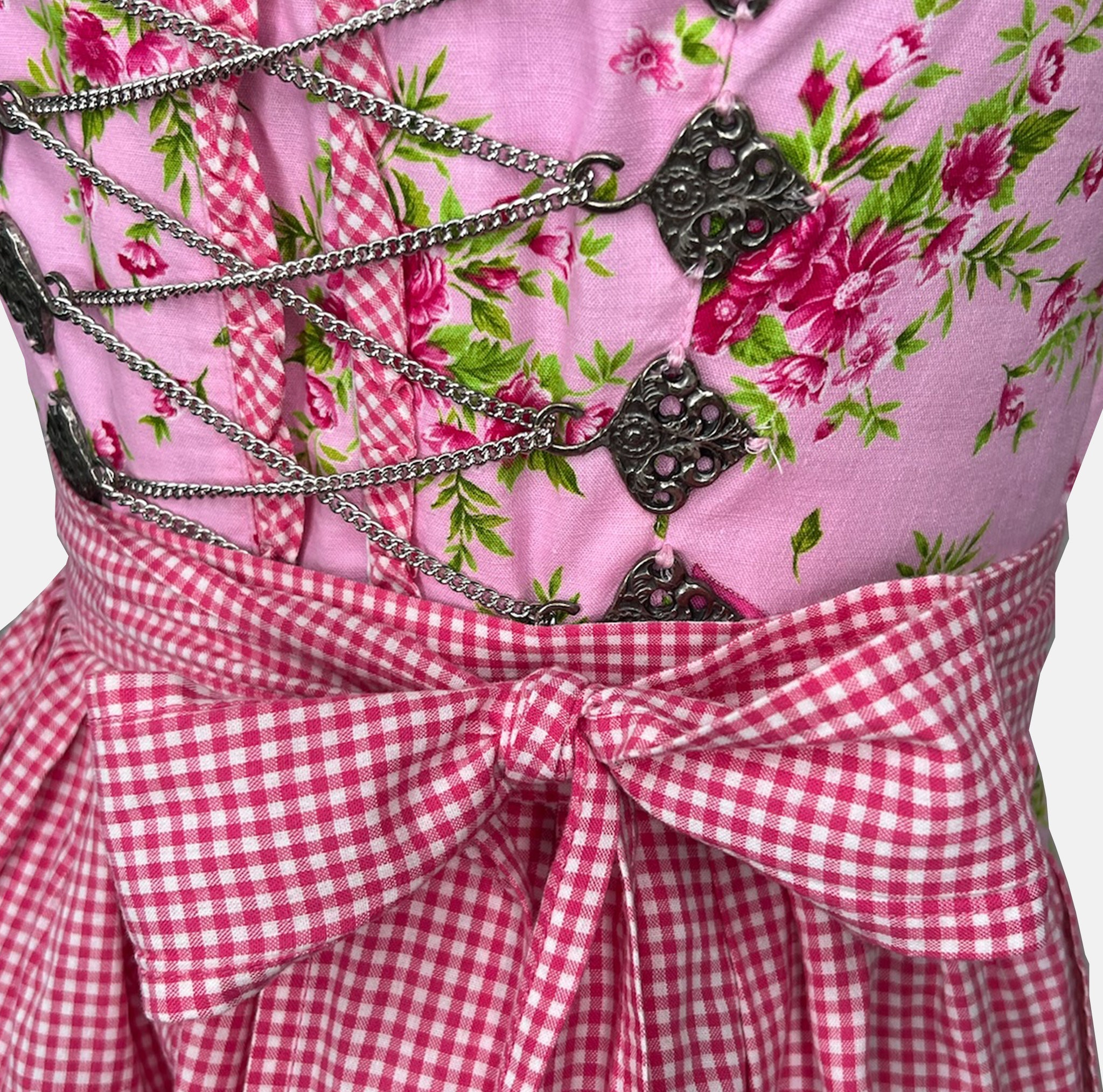 Berwin & Wolff dirndl in rose pink with satin ribbon lace bodice and matching apron—60 cm midi length, elegant and feminine, for Oktoberfest rental via Versatile.