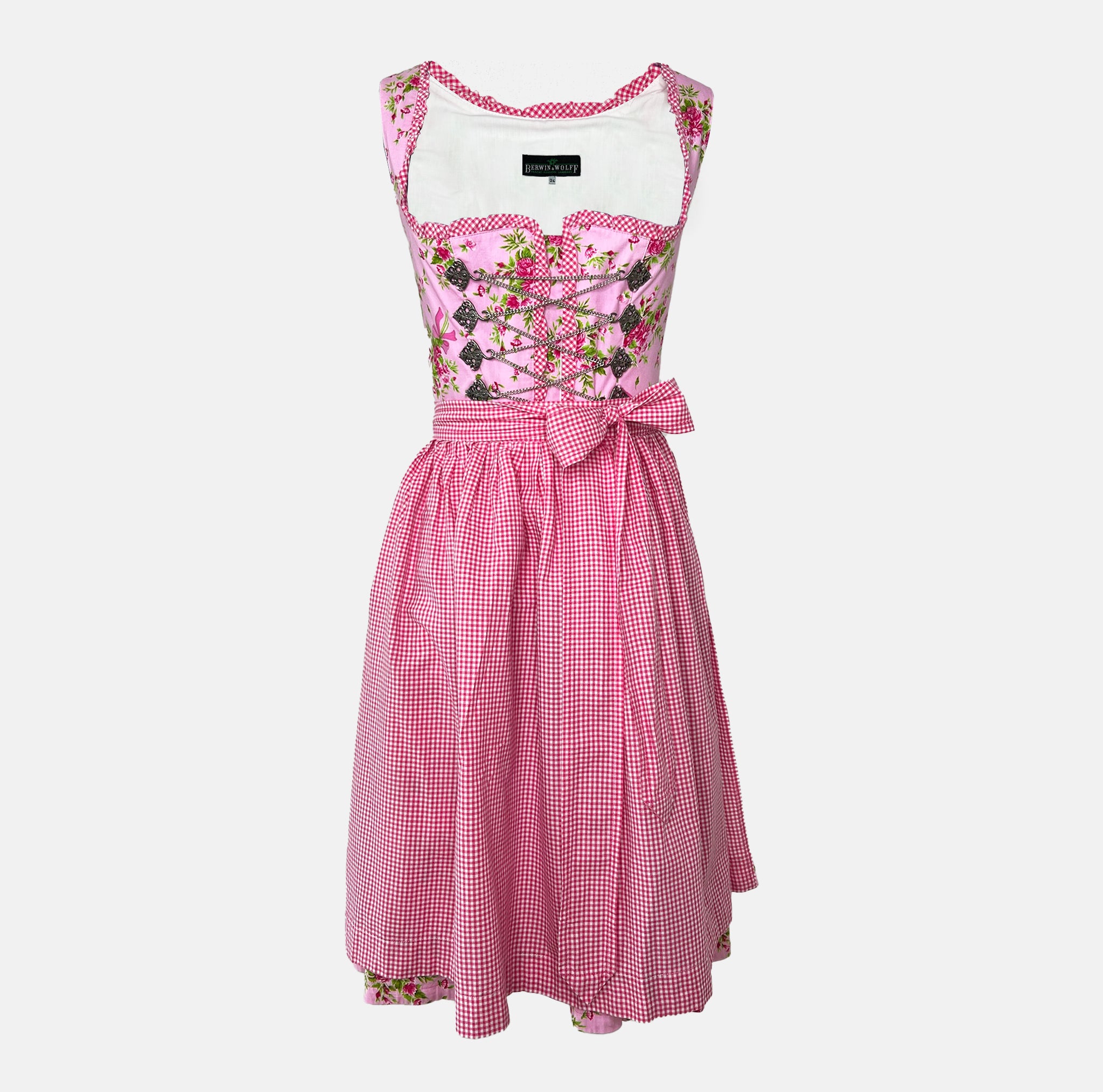 Berwin & Wolff dirndl in rose pink with satin ribbon lace bodice and matching apron—60 cm midi length, elegant and feminine, for Oktoberfest rental via Versatile.