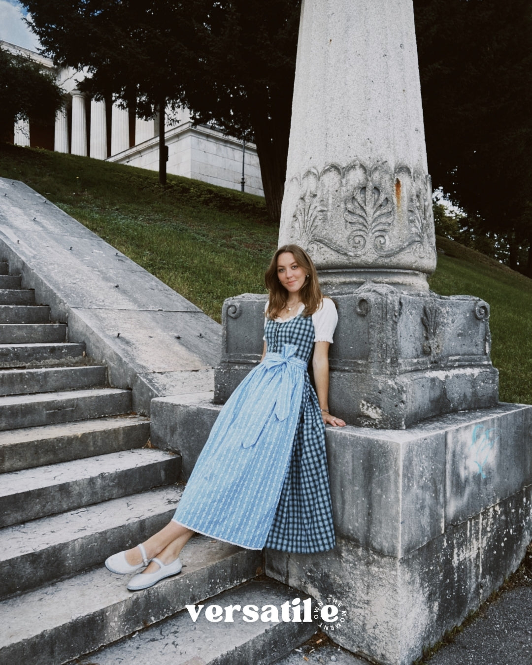 Berwin & Wolff rental dirndl in Munich with green and blue plaid bodice and light blue floral apron—perfect Oktoberfest dress hire.