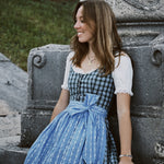 Munich Oktoberfest rental: Berwin & Wolff dirndl with green-blue check bodice and soft floral-patterned blue apron by Versatile OTM.