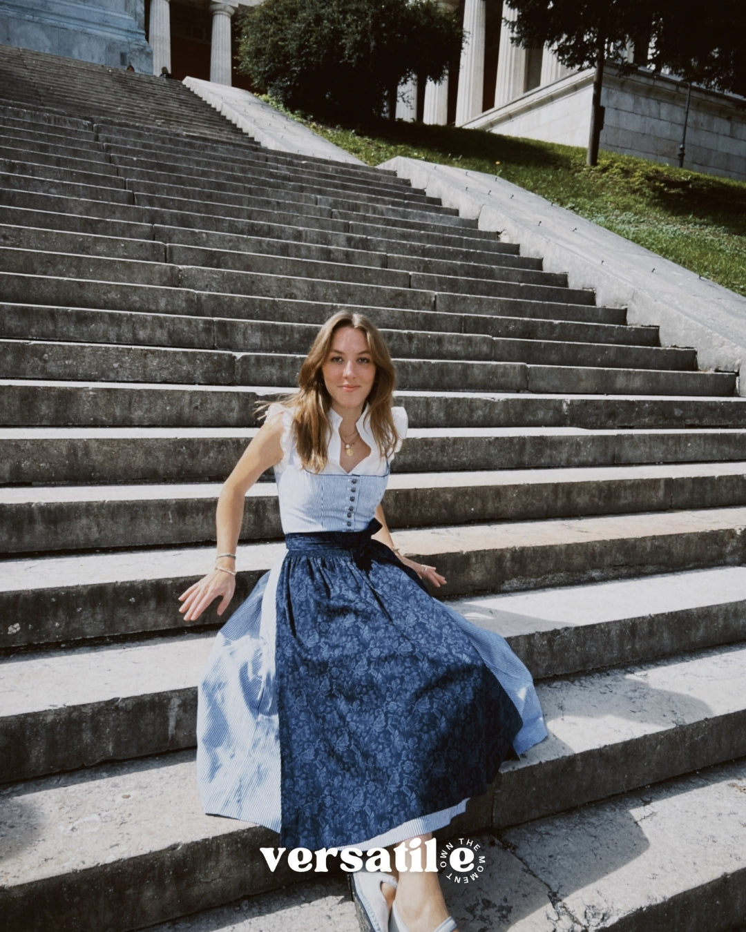 Oktoberfest-ready Berwin & Wolff dirndl in navy and white stripes with button closure and 75 cm skirt, available for rental at Versatile OTM Munich.