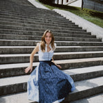 Oktoberfest-ready Berwin & Wolff dirndl in navy and white stripes with button closure and 75 cm skirt, available for rental at Versatile OTM Munich.