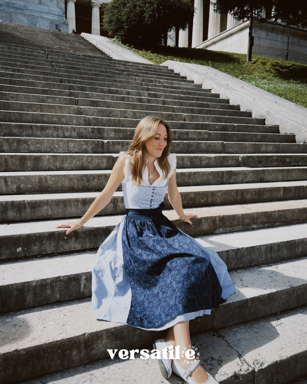 Oktoberfest-ready Berwin & Wolff dirndl in navy and white stripes with button closure and 75 cm skirt, available for rental at Versatile OTM Munich.