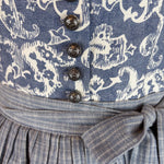 Rent the Berwin & Wolff Dirndl —dark blue ornate bodice, vintage silver buttons, pleated skirt and plaid apron, Oktoberfest dirndl rental