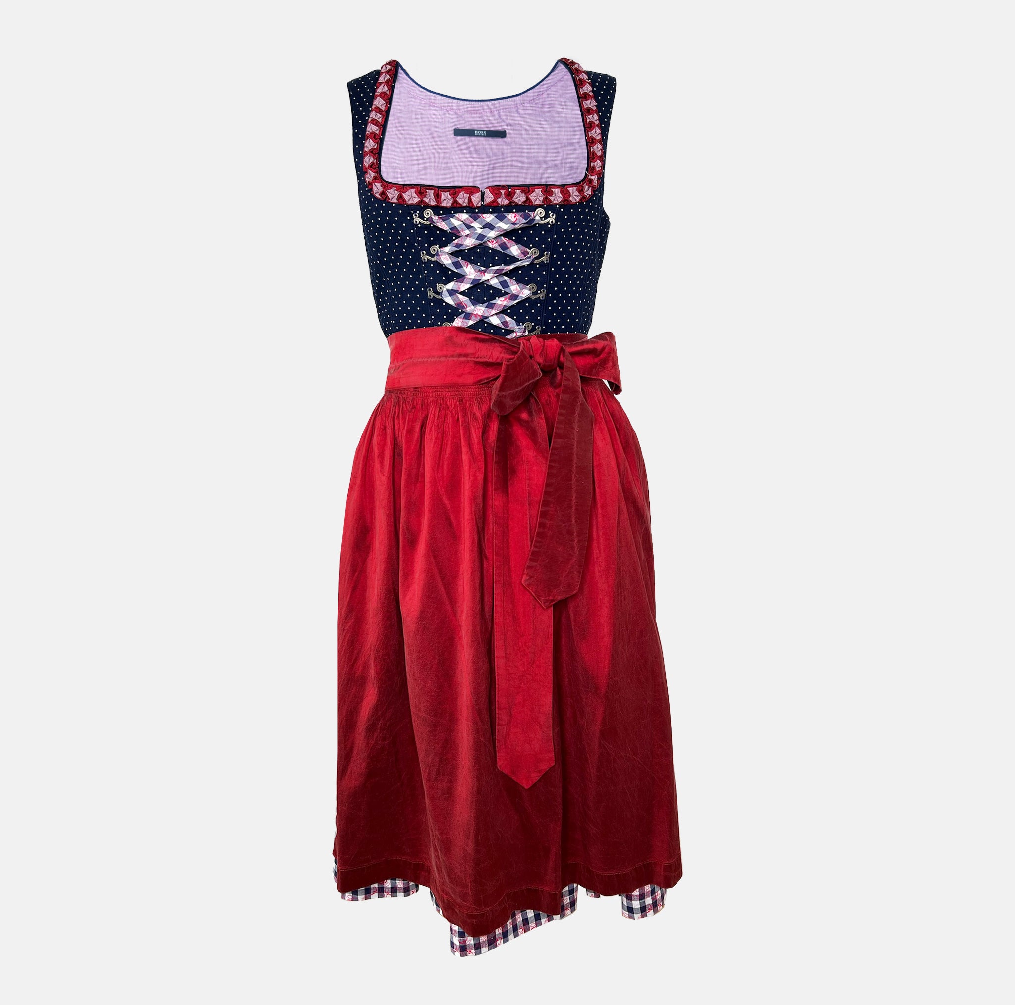 Boss Dirndl featuring a modern silhouette with bold details, combining traditional elements with fashion-forward edge – rentable at Versatile OTM.