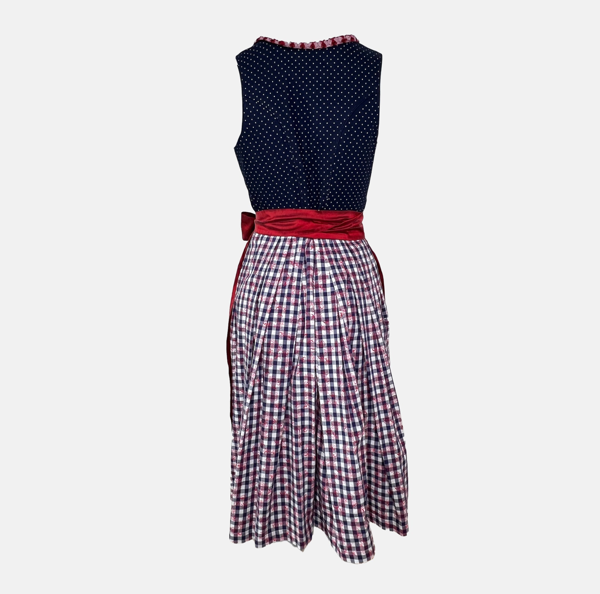 Boss Dirndl featuring a modern silhouette with bold details, combining traditional elements with fashion-forward edge – rentable at Versatile OTM.