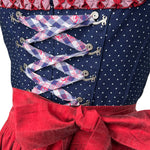 Boss Dirndl featuring a modern silhouette with bold details, combining traditional elements with fashion-forward edge – rentable at Versatile OTM.