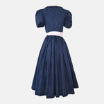 Rent premium Dirndl in Munich: Versatile Collection dress with vintage-inspired navy bodice and pale pink apron for Oktoberfest.