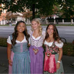 Three women wearing traditional German Dirndl dresses one bestseller Dirndl Krueger Dirndl. Ready to rent on Versatile OTM for Oktoberfest 