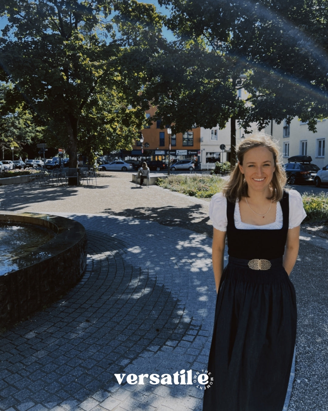 Gottseidank Monika dirndl rental in Munich – structured black pleated bodice with covered buttons, indigo denim skirt, square neckline; ideal Oktoberfest dress.