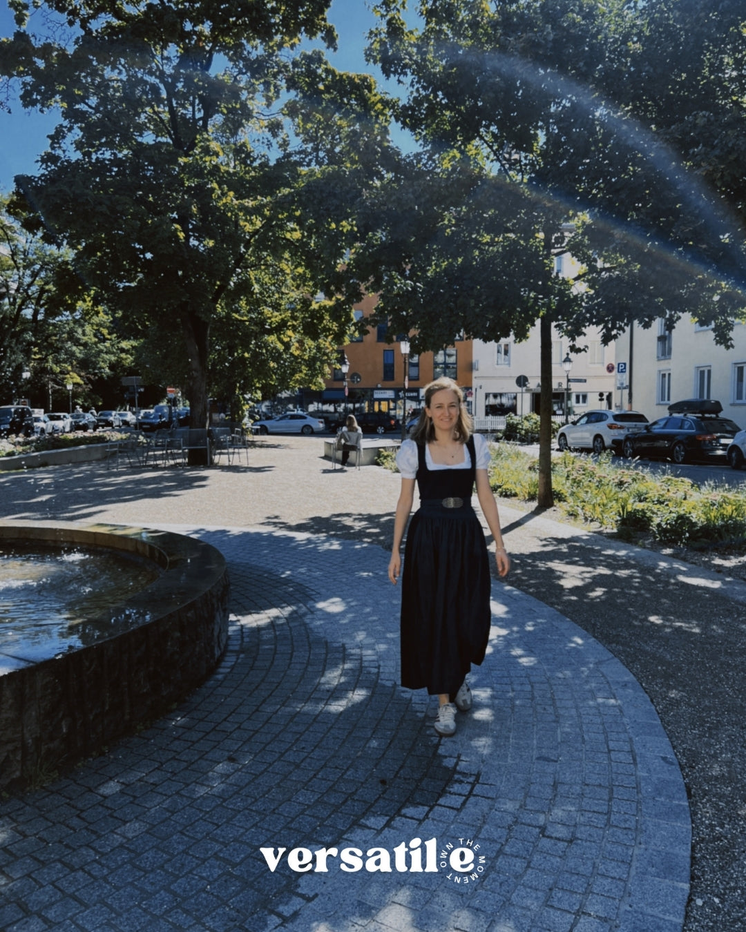 Munich rental dirndl – Gottseidank Monika with structured black pleated bodice, square neckline, and knee-length indigo denim skirt; great for Oktoberfest.