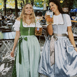 Rent your Hammerschmid Dirndl for Oktoberfest laugh and smile as much as these girls in their rented Dirndls ready to go and have fun
