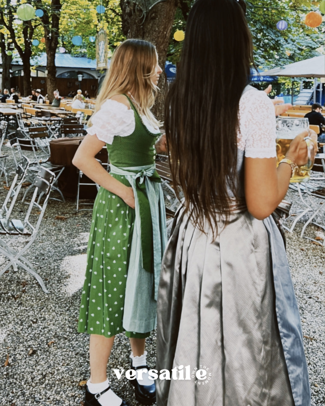 Two women in traditional German dirndls standing outdoors with versatile Dirndls rented Hammerschmid Dirndl 