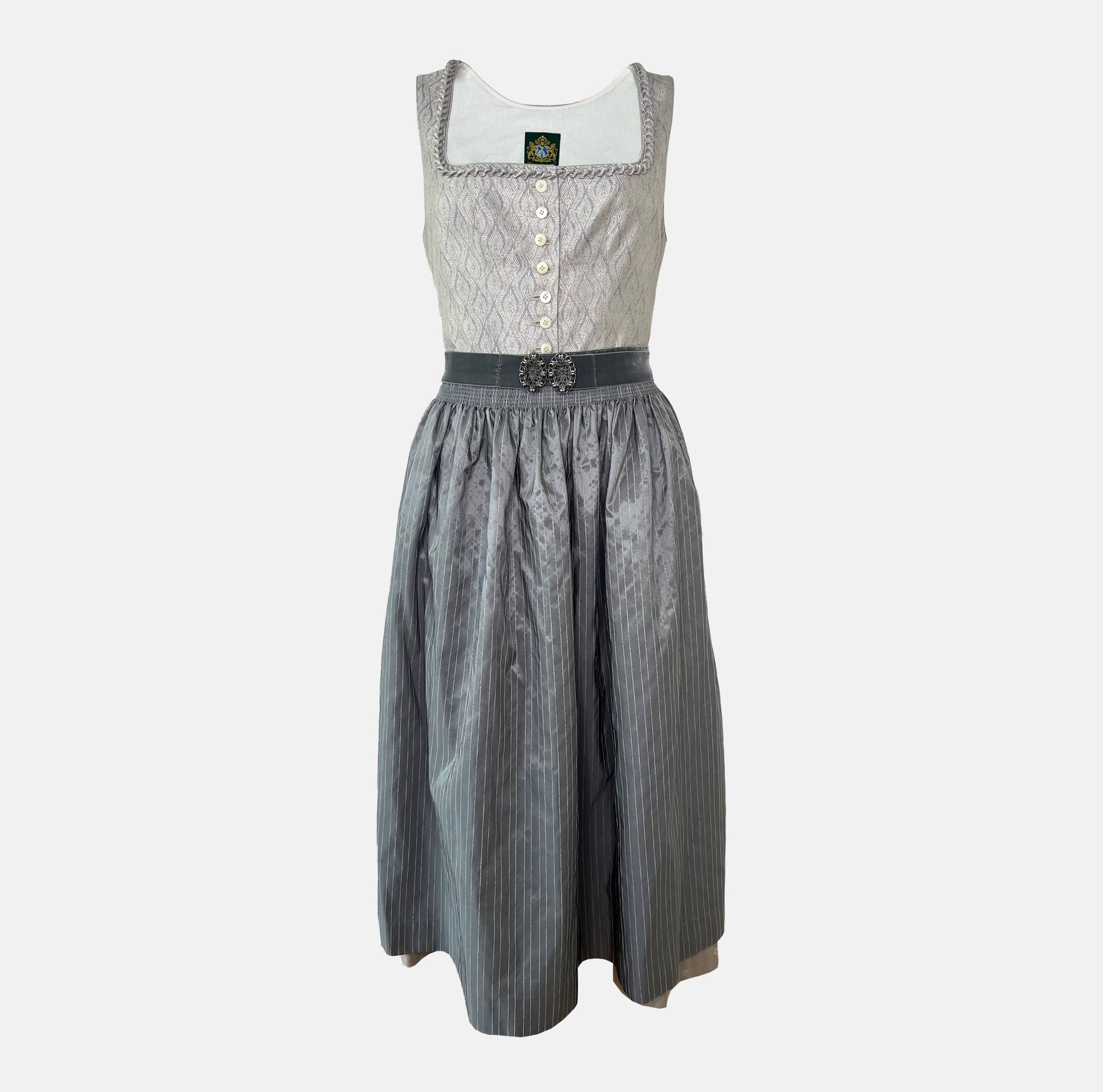 Hammerschmid Dirndl with silver bodice, grey pinstriped apron, and decorative belt buckle, available for rent at Versatile OTM.