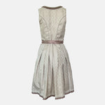 Krüger Bavarian rental dirndl with embroidered cream bodice, pink ribbon lacing, satin sash, and gold lace apron, available at Versatile OTM in Munich.