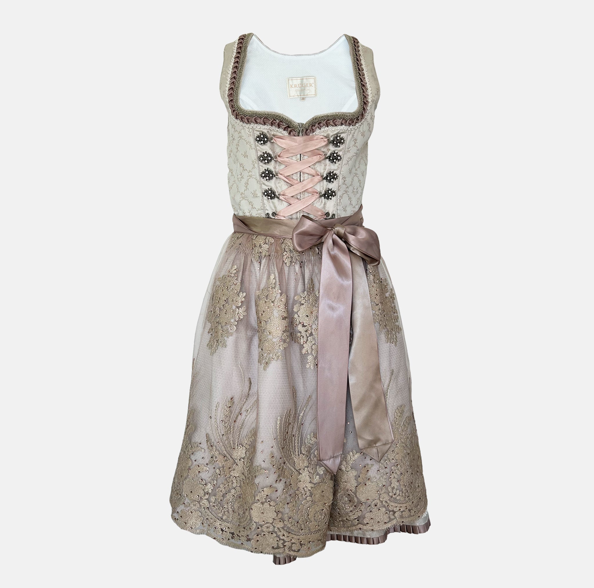 Krüger Bavarian rental dirndl with embroidered cream bodice, pink ribbon lacing, satin sash, and gold lace apron, available at Versatile OTM in Munich.