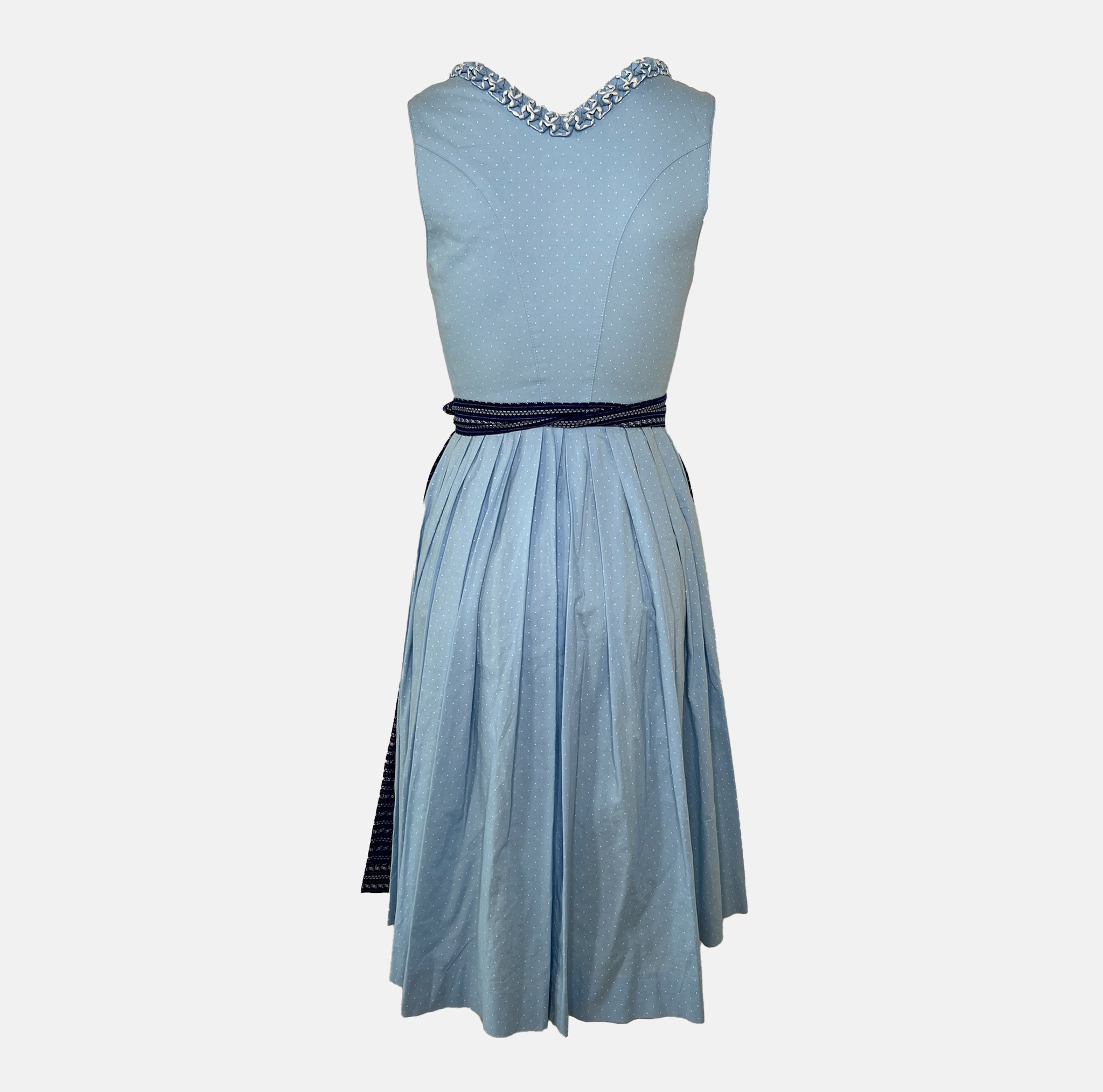 Back: Classic light blue and navy Krüger Dirndl with lace-trimmed neckline and patterned apron – available for rent via Versatile.