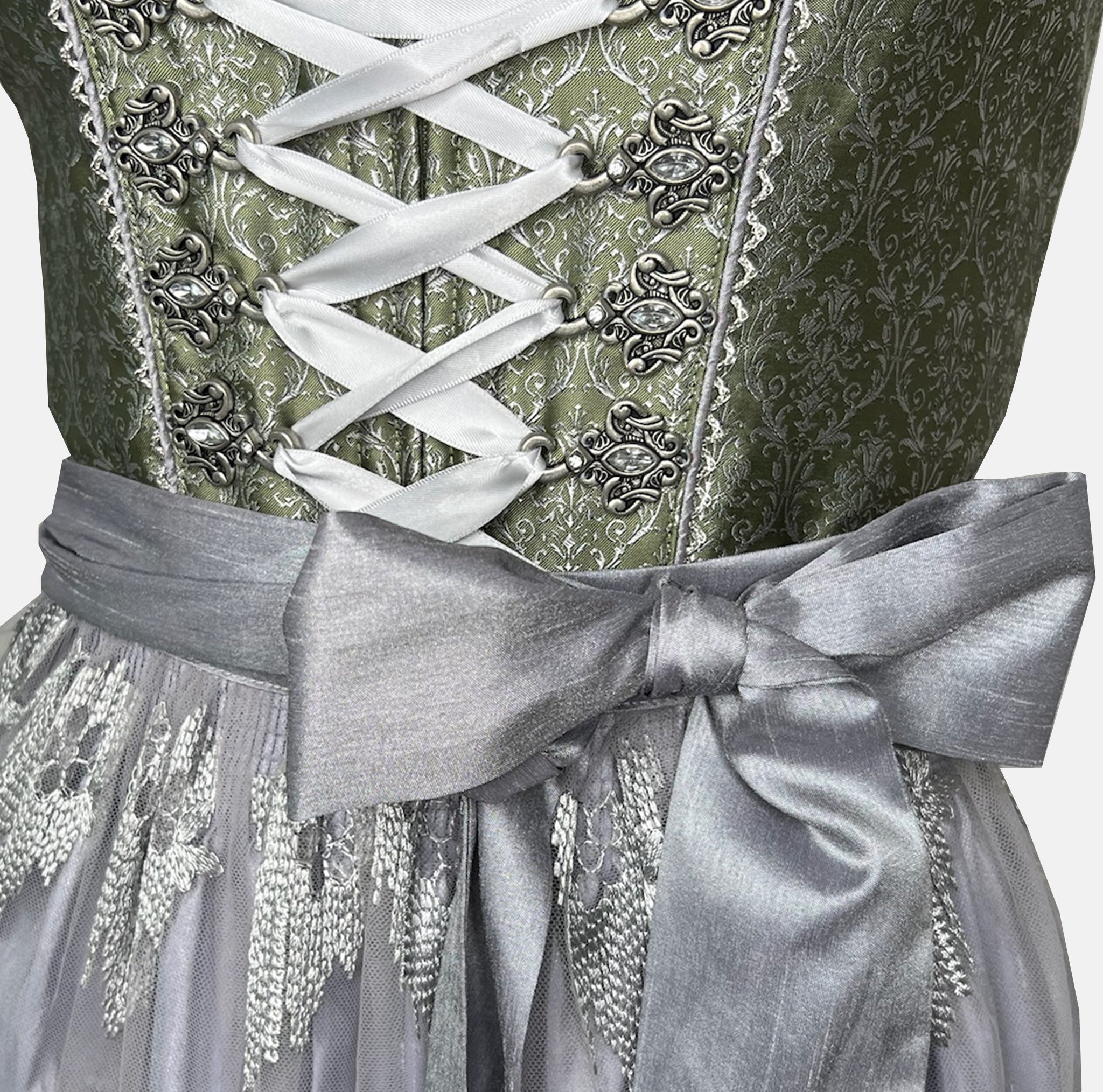 Green Krüger Collection Dirndl with silver corset lacing and embroidered silver tulle apron, available for rent on Versatile OTM.