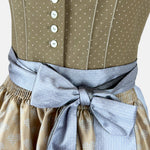 Natural and light-blue Krüger Toledo dirndl with heart-decorated apron, buttoned bodice, and midi-length skirt—timeless, festive elegance.