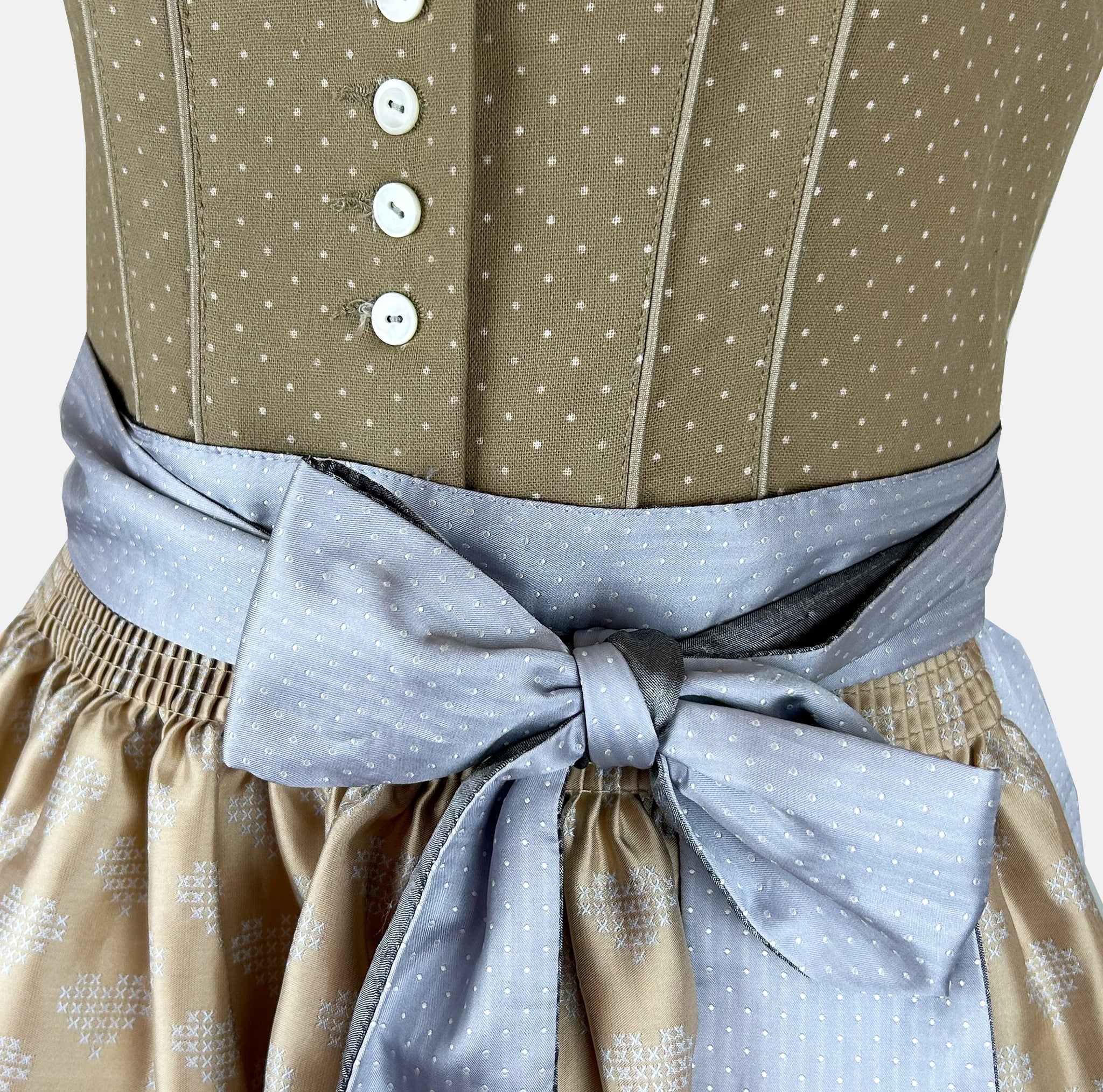 Natural and light-blue Krüger Toledo dirndl with heart-decorated apron, buttoned bodice, and midi-length skirt—timeless, festive elegance.