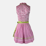 Krüger Madl dirndl with a pink heart-print bodice, green floral-trimmed apron, and pink gingham accents – playful and vibrant.