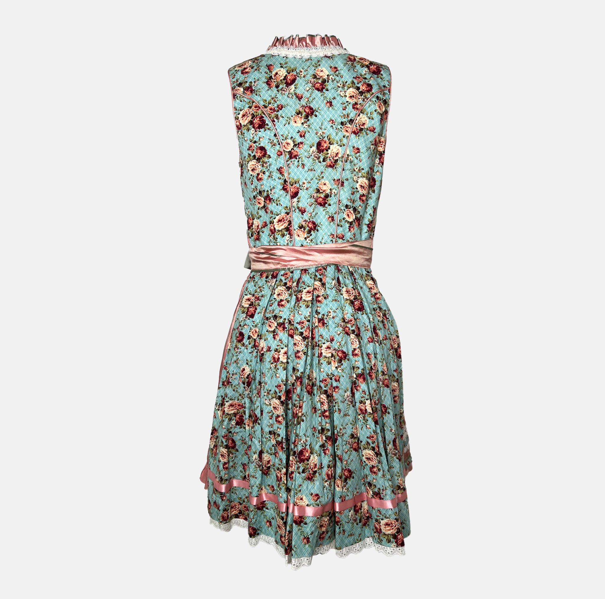 Krüger Madl Dirndl with aqua floral bodice, rosé satin skirt, green satin apron, and corset lacing. Mini 50 cm length—colorful and chic. Rent on Versatile!