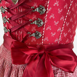 Red traditional Krüger Dirndl dress for rent in Munich at Versatile 