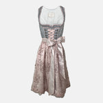 Krüger Dirndl with dusty blue bodice and pink embroidered apron. Available to rent on Versatile. Romantic, detailed, and perfect for Oktoberfest.
