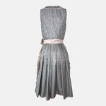 Krüger Dirndl with dusty blue bodice and pink embroidered apron. Available to rent on Versatile. Romantic, detailed, and perfect for Oktoberfest.