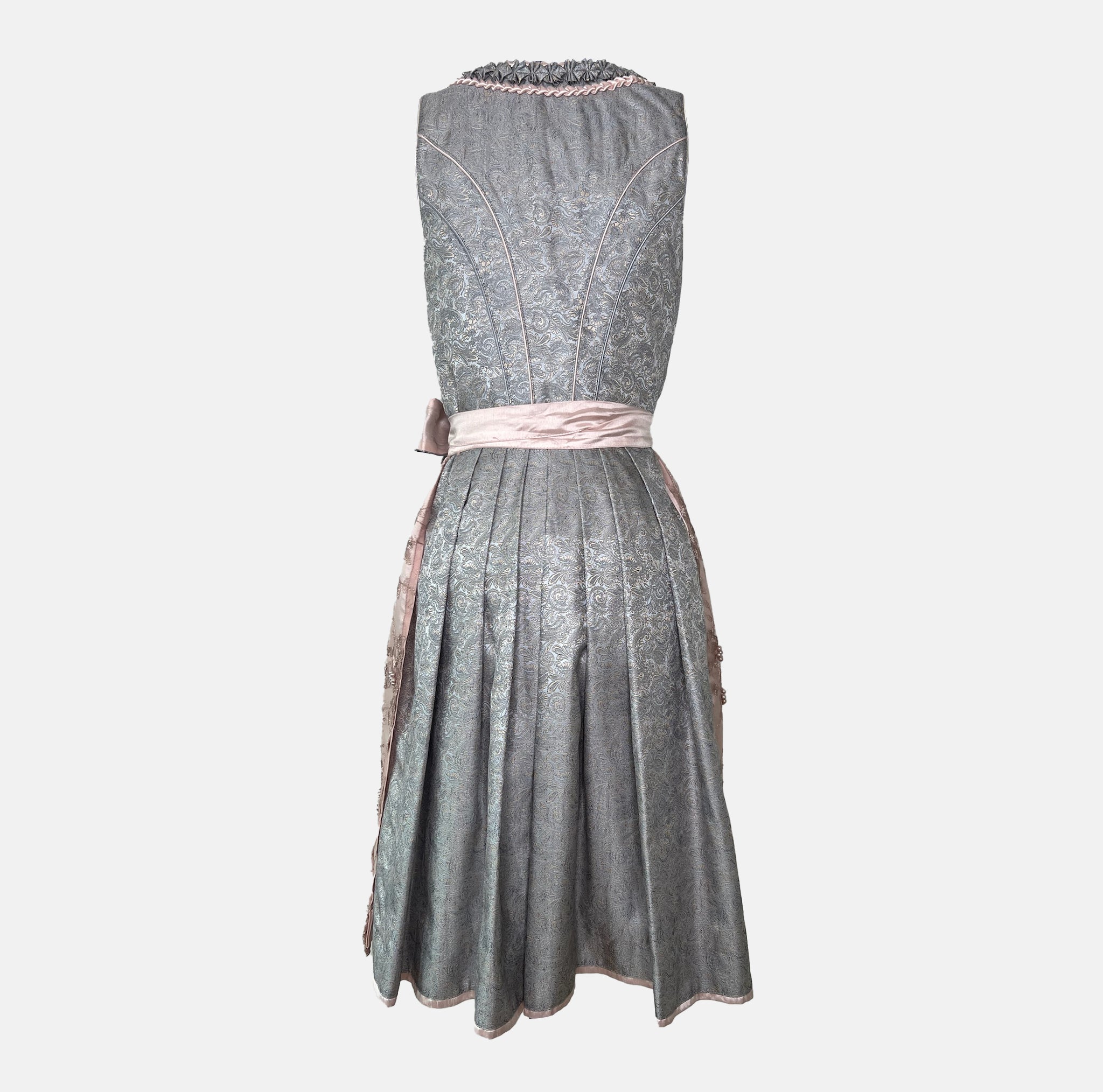 Krüger Dirndl with dusty blue bodice and pink embroidered apron. Available to rent on Versatile. Romantic, detailed, and perfect for Oktoberfest.