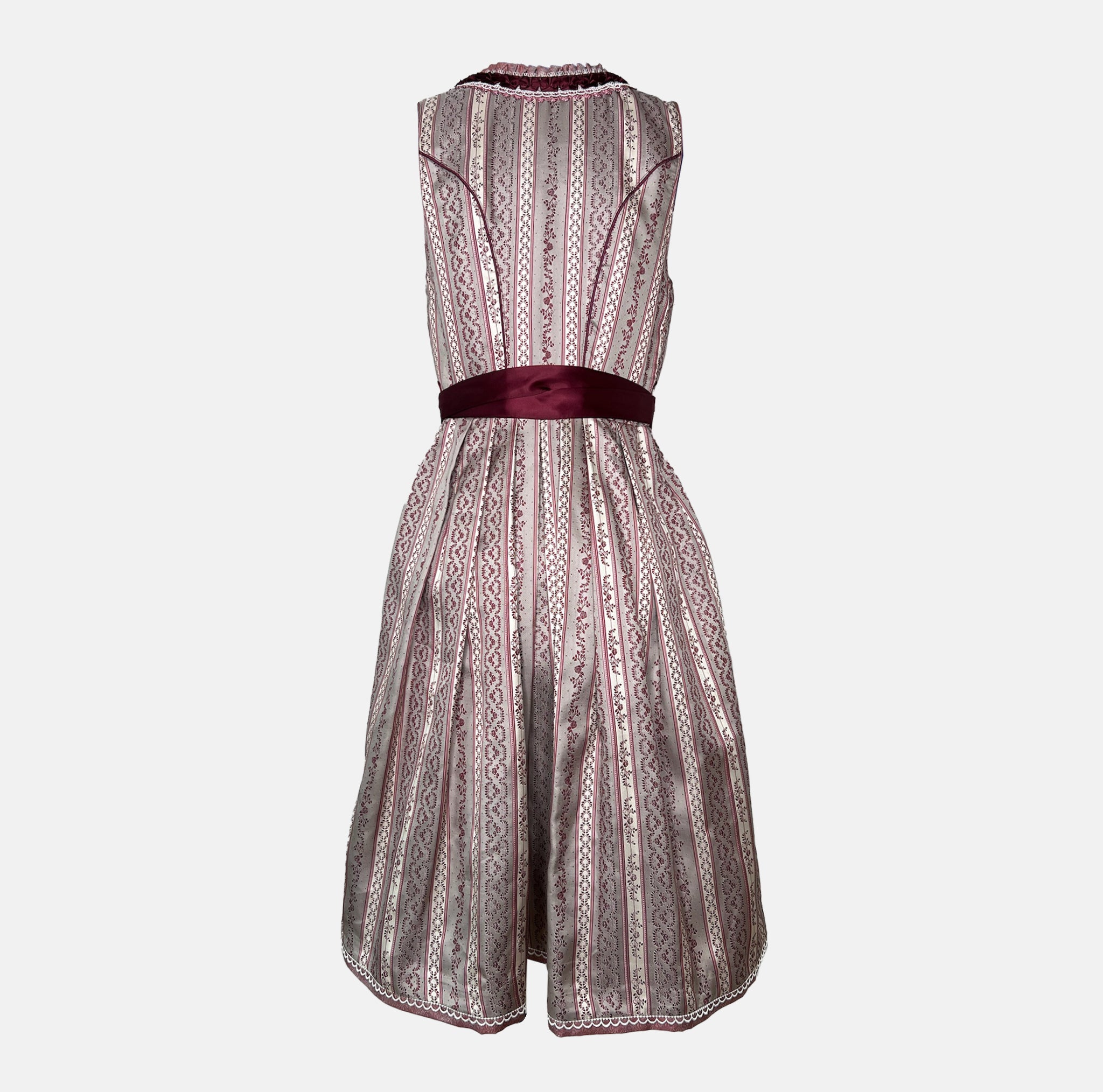Burgundy Krüger dirndl with floral lace embroidery, satin ribbon bow, and decorative bodice – available for rent at Versatile OTM.