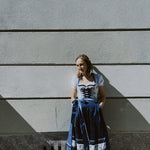 Blue floral Krüger mini dirndl with heart neckline and fitted bodice – stylish Oktoberfest rental in Munich via Versatile OTM