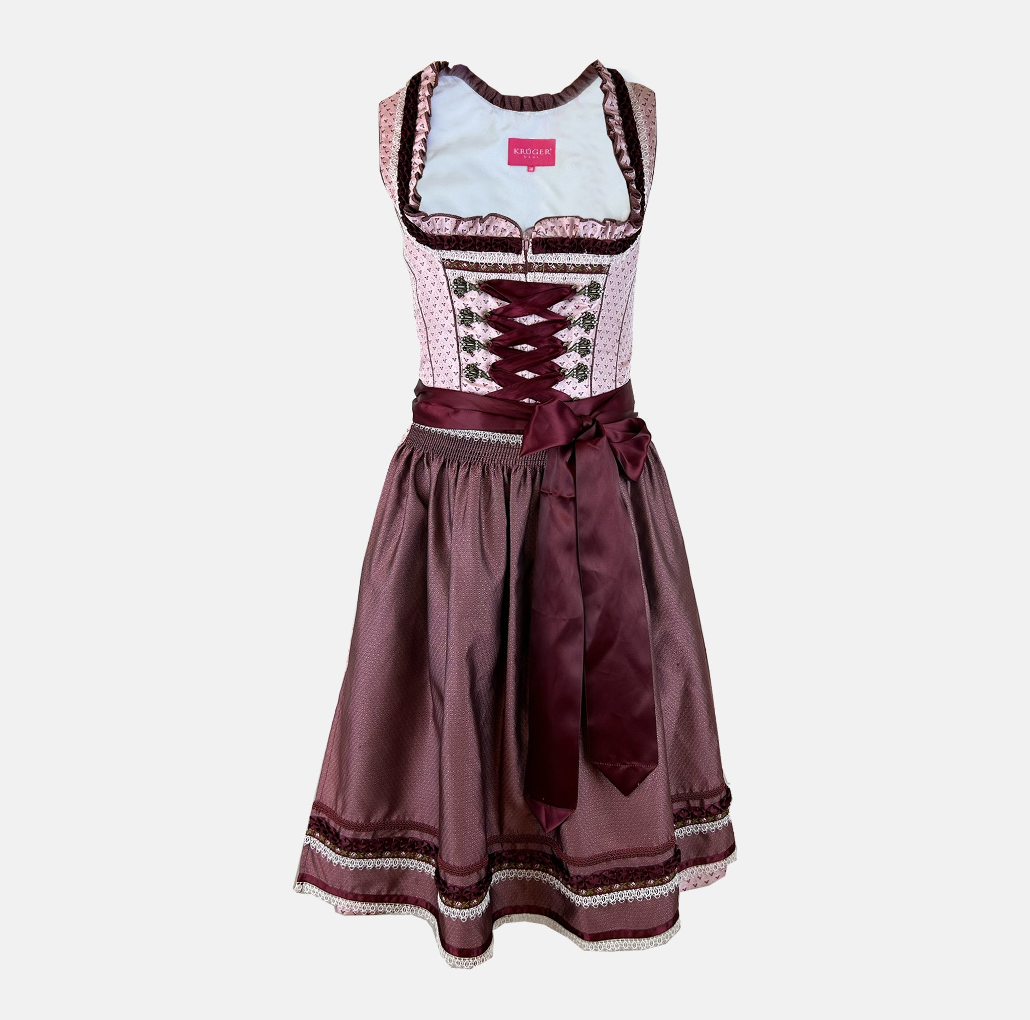 Elegant Krüger dirndl with pink bodice, burgundy lacing, and satin apron. Classic 60 cm length – available to rent in Munich or online.