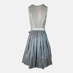 Elegant silver Krüger dirndl with lace details and patterned apron. Rent in Munich or online – perfect for Oktoberfest, weddings, and festive occasions.