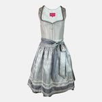 Elegant silver Krüger dirndl with lace details and patterned apron. Rent in Munich or online – perfect for Oktoberfest, weddings, and festive occasions.