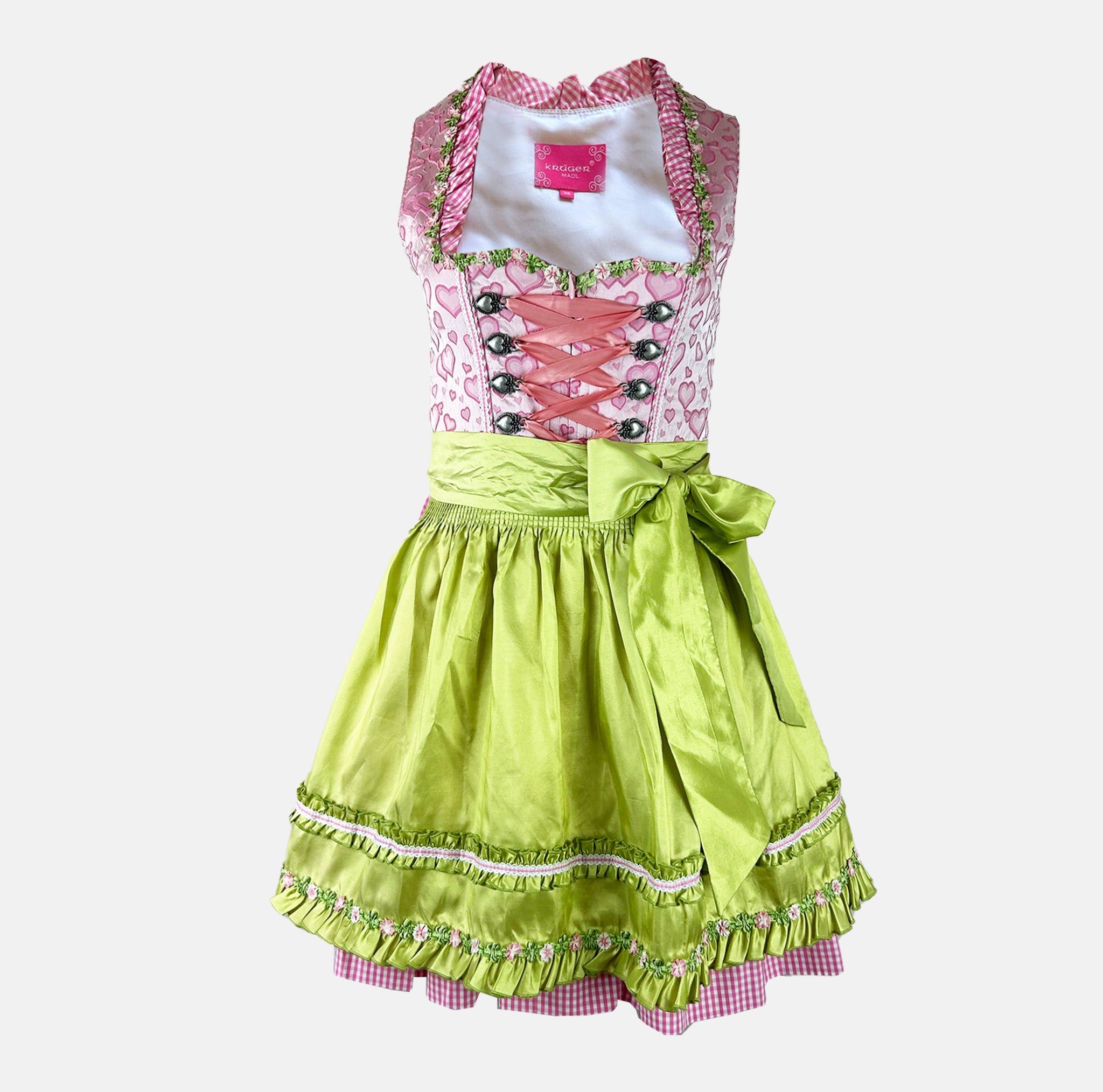 Krüger Madl dirndl with a pink heart-print bodice, green floral-trimmed apron, and pink gingham accents – playful and vibrant.