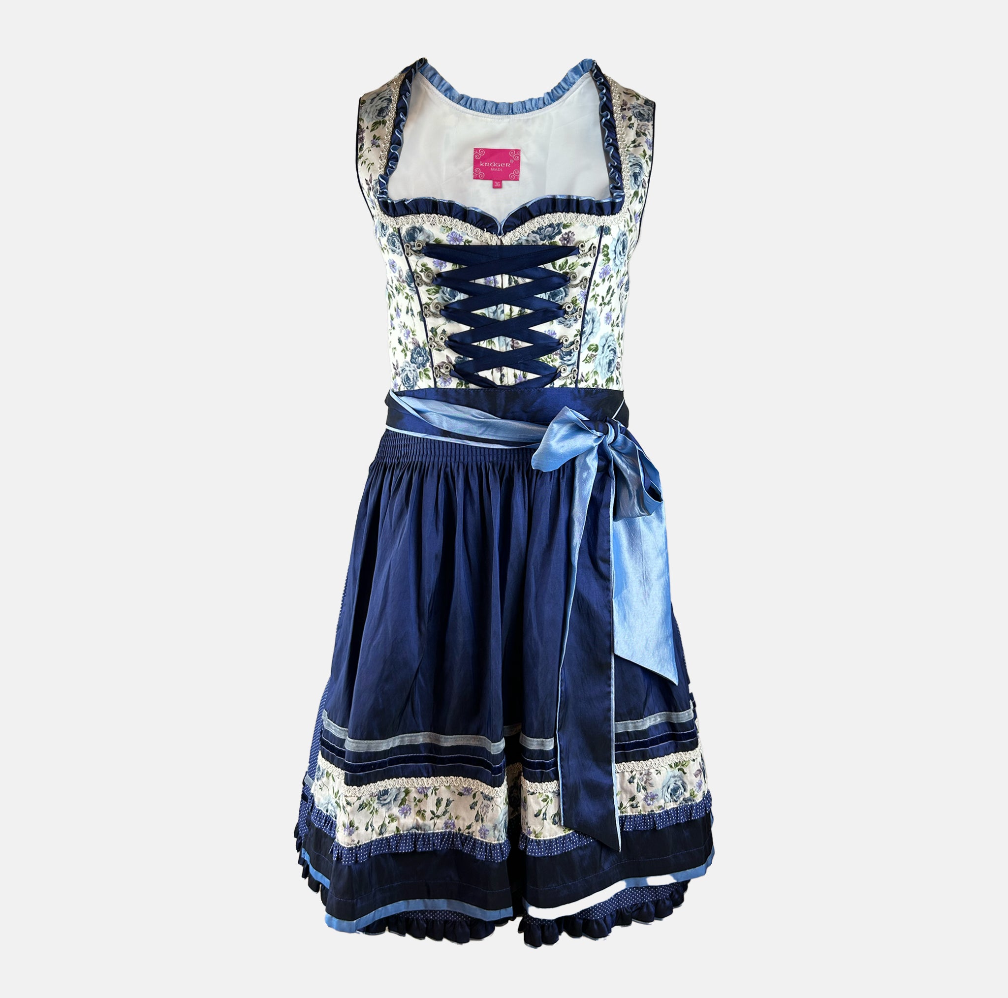 Bold blue dirndl dress with floral top and navy skirt on a white background for rent