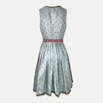 Dirndl dress by Krüger Madl featuring a light blue floral bodice, red gingham apron, and 60cm skirt with lace and ribbon accents.