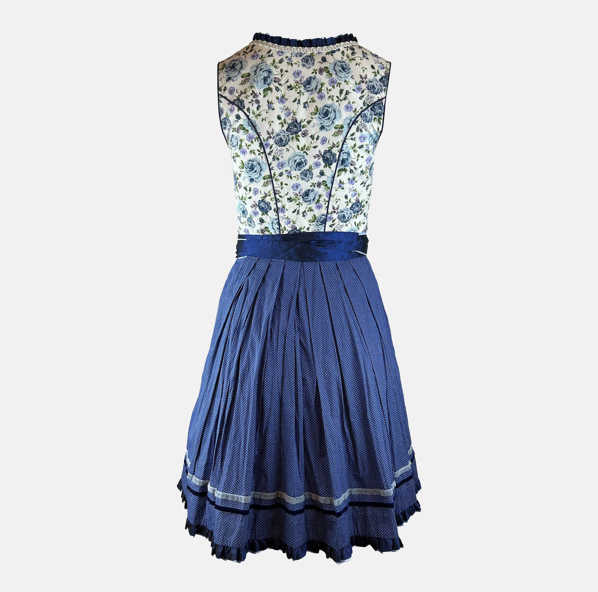Bold blue dirndl dress with floral top and navy skirt on a white background for rent