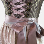 Affordable dirndl dress rental in Munich or online. Rent the elegant Krüger Dirndl Merida in bordeaux—perfect for Oktoberfest and events. Book your dirndl cheap today!