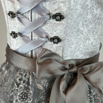 Elegant Macie dirndl for rent in Munich with 60 cm skirt, lace bodice, and detailed apron. Ideal for Oktoberfest, weddings, and traditional celebrations.